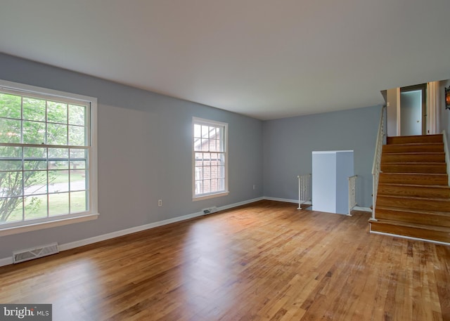 3900 Mark Ave, Harrisburg, PA 17110 - unfurnished room with wood finished floors, stairs, and baseboards