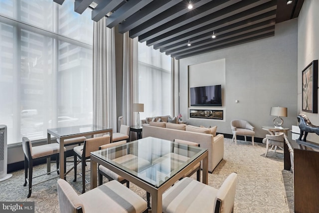 1111 19th St N Unit 2108, Arlington, VA 22209 - living area featuring beamed ceiling and a towering ceiling