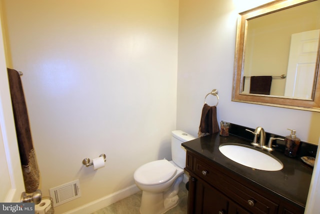 1300 Park Garden Ln, Reston, VA 20194 - half bath featuring toilet, vanity, and baseboards