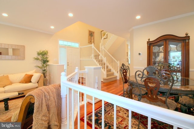 1300 Park Garden Ln, Reston, VA 20194 - living area featuring wood finished floors, recessed lighting, stairs, and ornamental molding