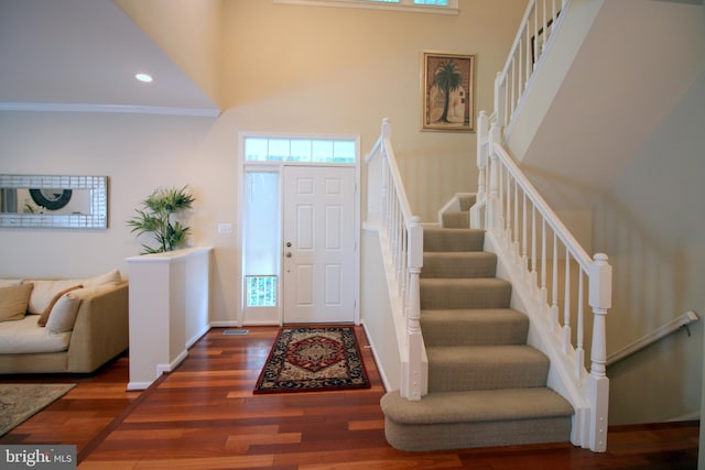 1300 Park Garden Ln, Reston, VA 20194 - foyer with stairway, wood finished floors, a towering ceiling, baseboards, and recessed lighting