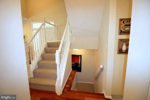 1300 Park Garden Ln, Reston, VA 20194 - stairway featuring wood finished floors and baseboards