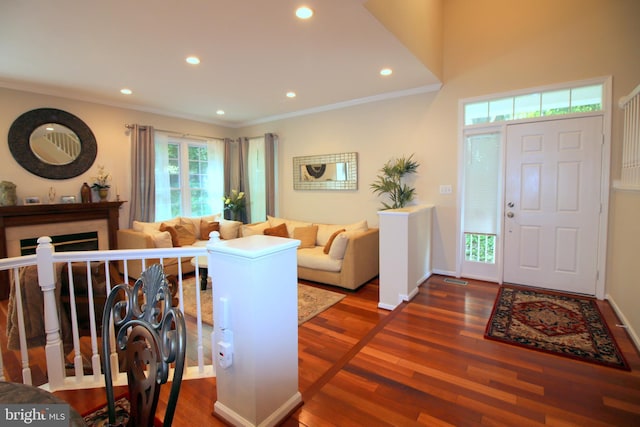 1300 Park Garden Ln, Reston, VA 20194 - foyer entrance featuring recessed lighting, wood finished floors, ornamental molding, baseboards, and a fireplace