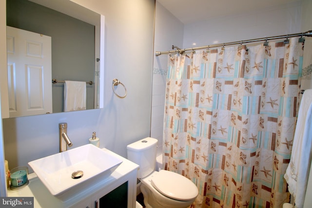 1300 Park Garden Ln, Reston, VA 20194 - bathroom with toilet, vanity, and a shower with shower curtain
