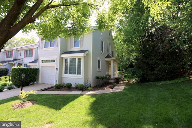 1300 Park Garden Ln, Reston, VA 20194 - view of front of home with an attached garage, concrete driveway, stucco siding, and a front yard