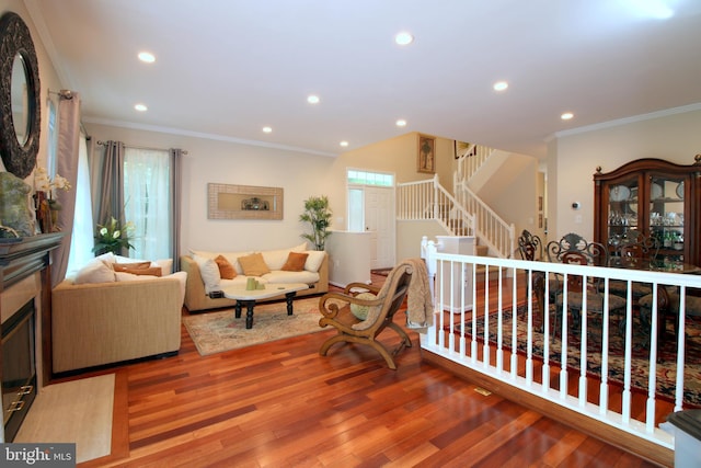 1300 Park Garden Ln, Reston, VA 20194 - living area featuring ornamental molding, recessed lighting, light wood-style flooring, and stairs