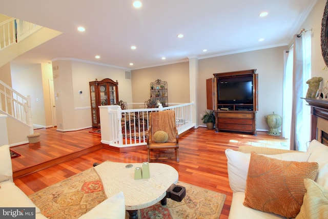 1300 Park Garden Ln, Reston, VA 20194 - living room featuring wood finished floors, recessed lighting, crown molding, stairs, and baseboards