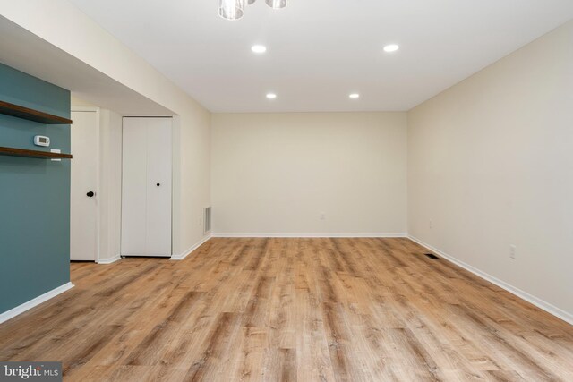 9441 Clocktower Ln, Columbia, MD 21046 - unfurnished bedroom featuring light wood-style floors, baseboards, recessed lighting, and two closets