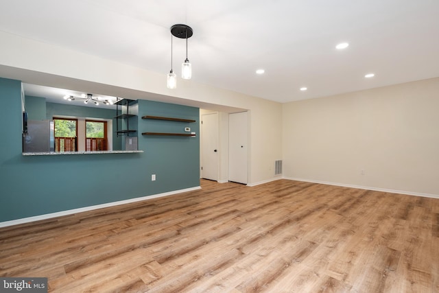 9441 Clocktower Ln, Columbia, MD 21046 - spare room with light wood finished floors, baseboards, recessed lighting, and a chandelier