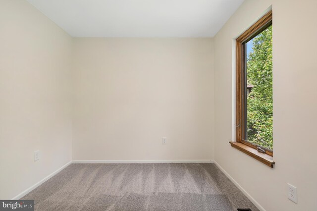 9441 Clocktower Ln, Columbia, MD 21046 - spare room with healthy amount of natural light, baseboards, and carpet flooring