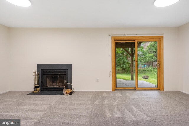 9441 Clocktower Ln, Columbia, MD 21046 - unfurnished living room featuring carpet, baseboards, and a fireplace with flush hearth