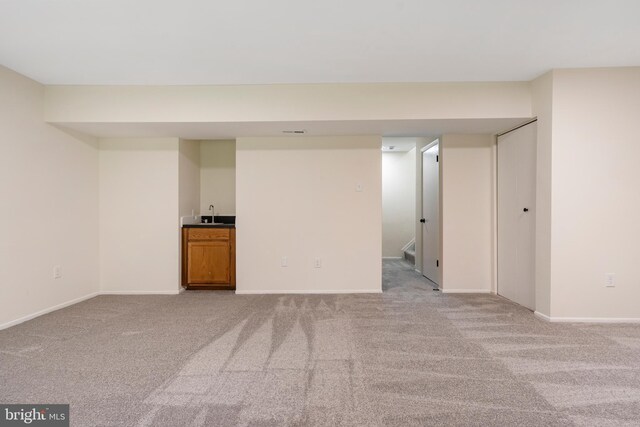 9441 Clocktower Ln, Columbia, MD 21046 - finished basement with carpet floors, baseboards, and a sink