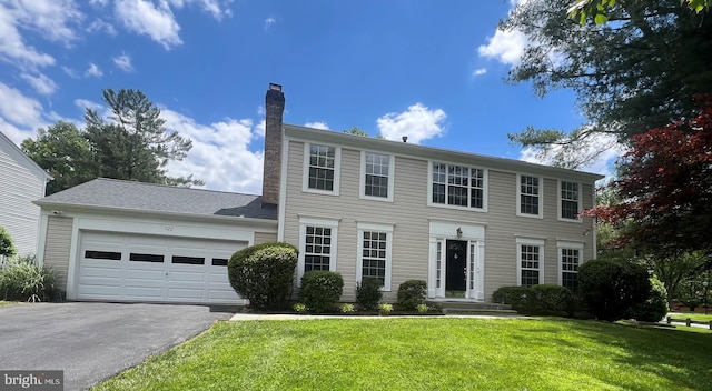 922 Pheasant Run Dr, Gaithersburg, MD 20878 - colonial home featuring driveway, a chimney, a garage, and a front lawn