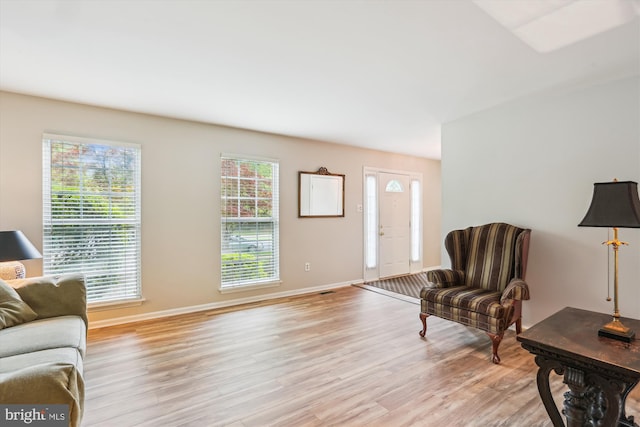 922 Pheasant Run Dr, Gaithersburg, MD 20878 - living area featuring light wood finished floors, healthy amount of natural light, and baseboards