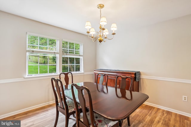 922 Pheasant Run Dr, Gaithersburg, MD 20878 - dining area featuring a chandelier, wood finished floors, and baseboards