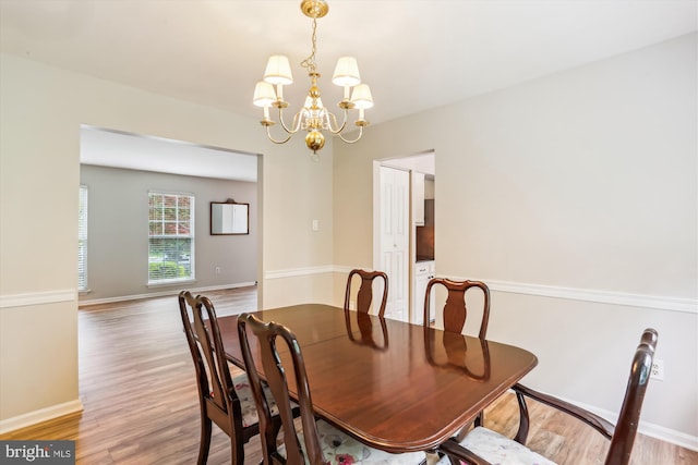 922 Pheasant Run Dr, Gaithersburg, MD 20878 - dining area with a chandelier, light wood-style floors, and baseboards