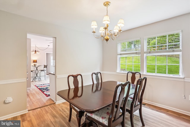922 Pheasant Run Dr, Gaithersburg, MD 20878 - dining area featuring a chandelier, light wood-style floors, and baseboards