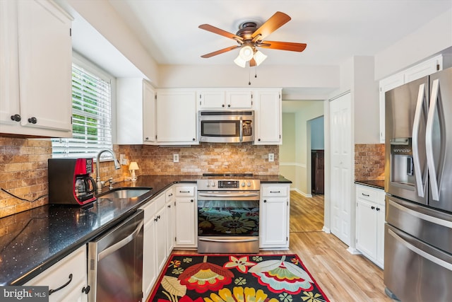 922 Pheasant Run Dr, Gaithersburg, MD 20878 - kitchen featuring stainless steel appliances, a sink, a ceiling fan, white cabinets, and light wood-style flooring