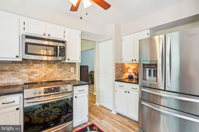 922 Pheasant Run Dr, Gaithersburg, MD 20878 - kitchen featuring stainless steel appliances, dark countertops, a ceiling fan, and white cabinets