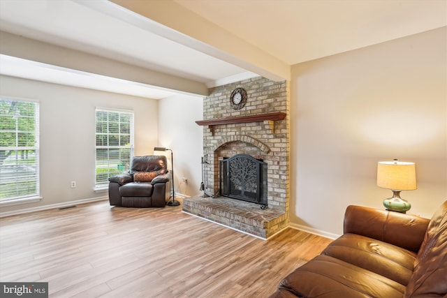 922 Pheasant Run Dr, Gaithersburg, MD 20878 - living area featuring wood finished floors, baseboards, a brick fireplace, and beamed ceiling