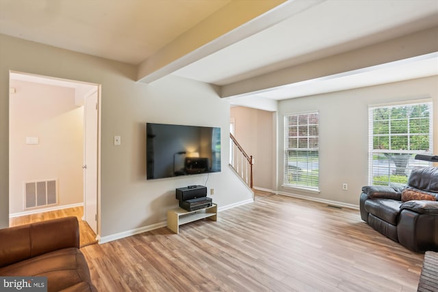 922 Pheasant Run Dr, Gaithersburg, MD 20878 - living area with light wood-style flooring, baseboards, stairway, and beam ceiling