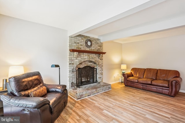 922 Pheasant Run Dr, Gaithersburg, MD 20878 - living area featuring light wood finished floors, baseboards, and a brick fireplace