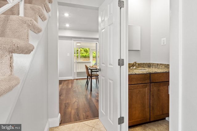 12419 Melling Ln, Bowie, MD 20715 - corridor featuring a sink, recessed lighting, baseboards, and light wood-style flooring