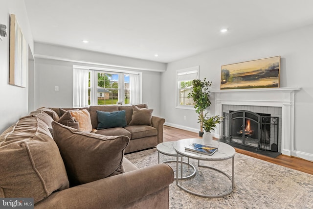 12419 Melling Ln, Bowie, MD 20715 - living room featuring a fireplace with flush hearth, wood finished floors, recessed lighting, and baseboards