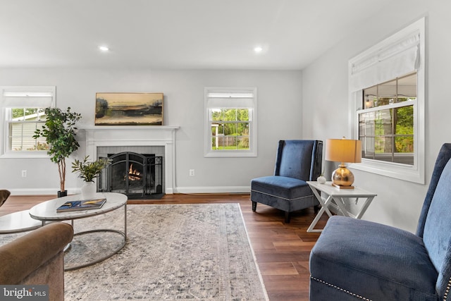 12419 Melling Ln, Bowie, MD 20715 - living room with plenty of natural light, a fireplace with flush hearth, wood finished floors, recessed lighting, and baseboards