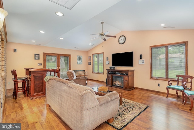 1199 Long Valley Rd, Westminster, MD 21158 - living area with lofted ceiling, light wood-style flooring, a glass covered fireplace, baseboards, and a ceiling fan