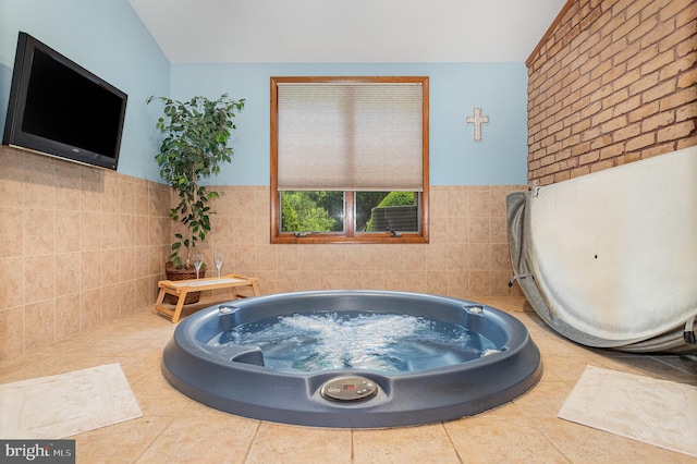1199 Long Valley Rd, Westminster, MD 21158 - bathroom featuring tile walls, a bath, lofted ceiling, and a wainscoted wall