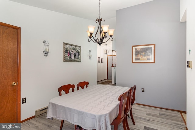 1199 Long Valley Rd, Westminster, MD 21158 - dining area with light wood-style flooring, a chandelier, a baseboard heating unit, and baseboards
