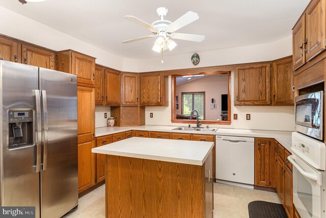1199 Long Valley Rd, Westminster, MD 21158 - kitchen with stainless steel appliances, a sink, brown cabinets, light countertops, and a ceiling fan