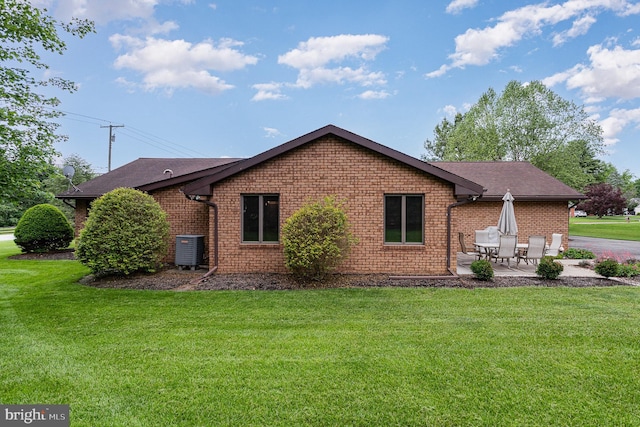 1199 Long Valley Rd, Westminster, MD 21158 - view of home's exterior with a patio, a lawn, cooling unit, and brick siding