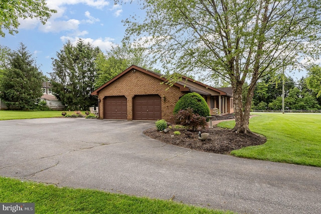 1199 Long Valley Rd, Westminster, MD 21158 - view of front of house featuring brick siding, asphalt driveway, a garage, and a front yard