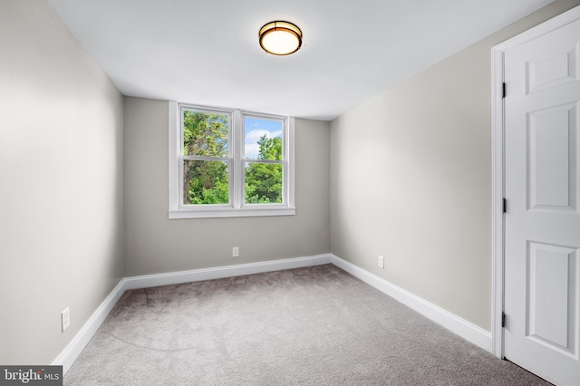 1402 W Old Cold Spring Ln, Baltimore, MD 21209 - empty room featuring carpet floors and baseboards