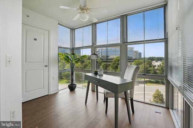 11800 Sunset Hills Rd Unit 717, Reston, VA 20190 - office area with floor to ceiling windows, ceiling fan, wood finished floors, and a towering ceiling