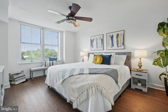 11800 Sunset Hills Rd Unit 717, Reston, VA 20190 - bedroom with wood finished floors, baseboards, a textured ceiling, and a ceiling fan