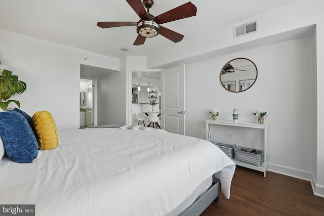 11800 Sunset Hills Rd Unit 717, Reston, VA 20190 - bedroom featuring dark wood-style flooring, baseboards, ensuite bath, and a ceiling fan