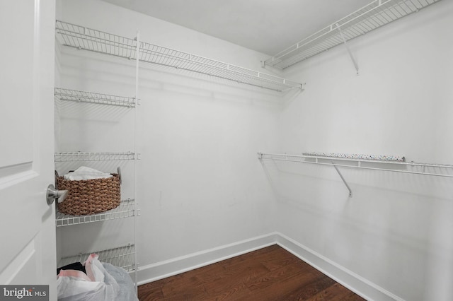 11800 Sunset Hills Rd Unit 717, Reston, VA 20190 - spacious closet with dark wood-style flooring