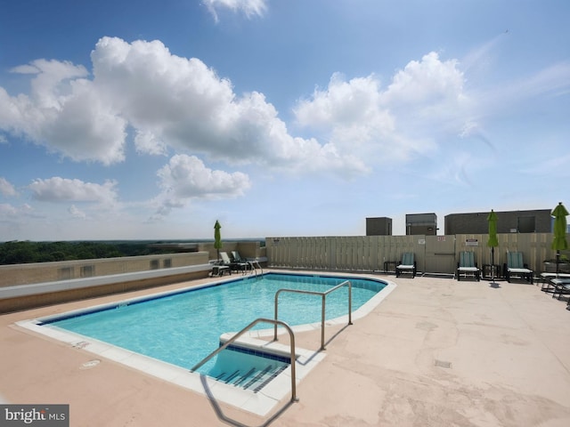 11800 Sunset Hills Rd Unit 717, Reston, VA 20190 - community pool featuring a patio area