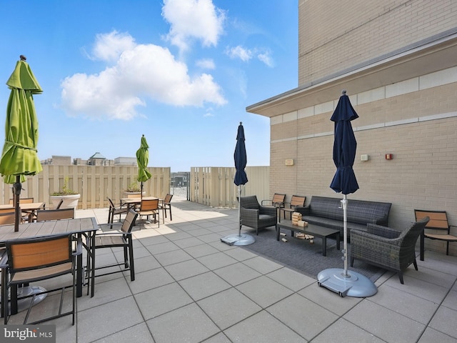 11800 Sunset Hills Rd Unit 717, Reston, VA 20190 - view of patio featuring outdoor dining area and an outdoor hangout area