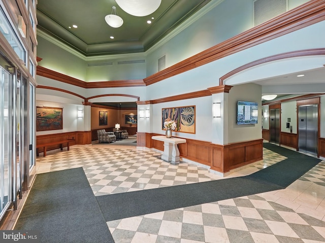 11800 Sunset Hills Rd Unit 717, Reston, VA 20190 - lobby with wainscoting, crown molding, and a high ceiling