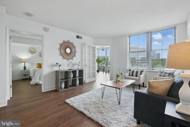 11800 Sunset Hills Rd Unit 717, Reston, VA 20190 - living room featuring dark wood-type flooring and baseboards