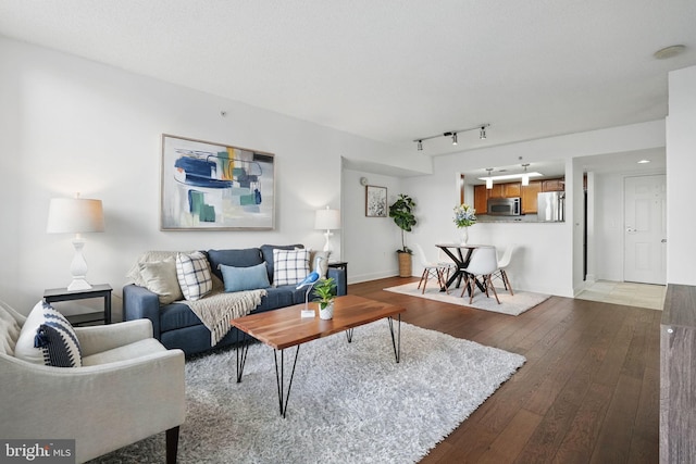 11800 Sunset Hills Rd Unit 717, Reston, VA 20190 - living room featuring hardwood / wood-style flooring and track lighting