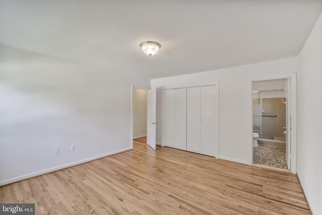 12403 Sir Lancelot Dr, Glenn Dale, MD 20769 - unfurnished bedroom with wood finished floors, baseboards, and a closet