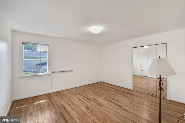 12403 Sir Lancelot Dr, Glenn Dale, MD 20769 - empty room with wood finished floors and baseboards