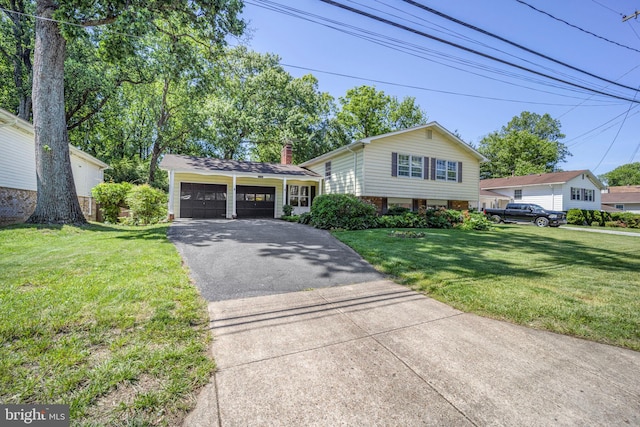 12403 Sir Lancelot Dr, Glenn Dale, MD 20769 - split level home with an attached garage, asphalt driveway, a front lawn, and a chimney