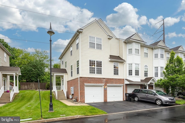 19 Cameron Ct, Royersford, PA 19468 - view of front facade with asphalt driveway, brick siding, and a garage