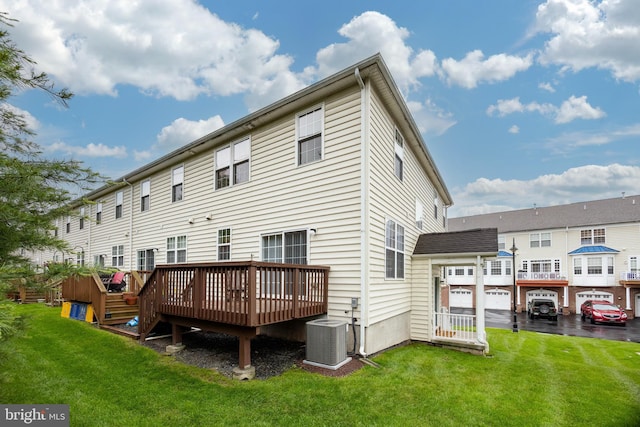 19 Cameron Ct, Royersford, PA 19468 - rear view of house featuring central AC unit, a deck, and a lawn